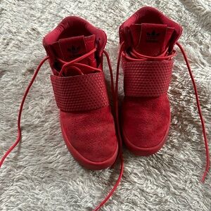 Red Adidas Tubular shoes. Red soles .